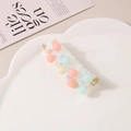 Elegant white spiral hair tie with colorful macaron beads on a heart-shaped tray - Colorful Beaded