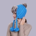 Blue knit trapper hat with cable pattern, faux fur trim and decorative pom-poms - Blue