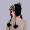 Black knit earflap beanie with grey faux fur trim and three large decorative pom poms - Black