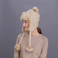 Chic beige knit trapper hat with soft faux fur lining and decorative pom-poms on the side - Beige