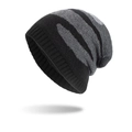 Winter long knit beanie featuring classic black and grey striped patchwork pattern - Black