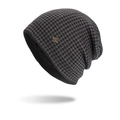 Winter beanie with black and grey plaid pattern, metal badge, and fleece lining warmth - Fleece Lined Houndstooth (Black) / Black