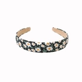 Chic women's headband featuring a black fabric wrap with elegant white daisy floral prints - Daisy - Black