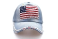 Light blue denim baseball cap featuring rhinestone American flag and frayed brim detail - Light Blue