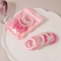 Set of 6 pink spiral telephone wire hair ties with floral and star patterns in a pouch - Pink Series