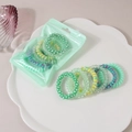 Set of 6 colorful spiral telephone wire hair ties in vibrant candy colors and patterns - Green System