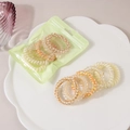 Élastiques à cheveux spirale aux tons chauds avec motifs d'étoiles et de fleurs - Série Jaune