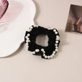 Elegant black velvet scrunchie featuring white faux pearls for a vintage aesthetic hair look - Black