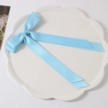 Light blue double-layered ribbon bow hair clip with long streamers on a white plate - Blue