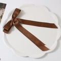 Sweet coffee brown satin ribbon bow hair clip displayed on white ceramic floral tray - Dark Coffee