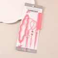 Rosa 4-teiliges Haarstyling-Set mit Topsy Tail und Stielkamm auf der Verpackung - Rosa