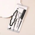 Schwarzes 4-teiliges Haarstyling-Set mit Haarschleifen und Kamm auf Kartenverpackung - Schwarz