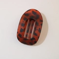 Flat lay of tortoise shell patterned matte hair claw clip in dark reddish brown - Oval Clip (Bulk) / Matte Dark Tortoiseshell