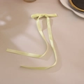 Pale lemon yellow satin bow hair clip with long ribbons in soft natural window lighting - Light Yellow