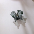 Translucent dark green butterfly hair claw clip with golden spring on white background - 5cm / Black