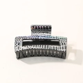 Elegant holographic leopard print hair claw clip with black and white animal patterns - Checkerboard