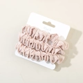 Lot de trois chouchous en satin rose champagne avec une texture de soie élégante - Rose Lotus