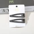 Pair of black alloy triangle hair clips with grey rhinestones on a display card - Gun Black Right-angle Teardrop Small Diamond