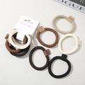 Set of braided earth tone hair ties with leather labels on a stylish minimalist background - Style G / Earth Tone Combo