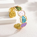 Detailed close-up of vintage hollow enamel rose open cuff bracelet with colorful patterns - Dark Green