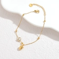 Elegante pulsera de acero inoxidable dorado con cristal de corazón y dijes - Estilo Fresa (Dorado)