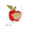 Detail view of red enamel apple brooch with green and white rhinestones, size 3.3cm x 3.1cm - Faceted Apple