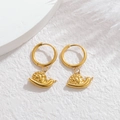 Detailed close-up of golden hoop earrings featuring intricate snail-shaped pendants - Snail