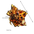 Macro view of leopard floral resin ring with 5.4cm diameter and adjustable gold band - Leopard Flower Style D (S-R912-D)