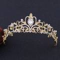 Macro detail of golden baroque crown featuring white rhinestones and large teardrop crystal - Gold (H1002)