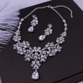 Elegant bridal jewelry set with crystal rhinestone necklace and teardrop earrings on display - Necklace And Earrings (Earring Post) Without Box / Silver