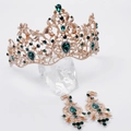Macro detail of Baroque emerald crown and earrings set in rose gold finish metal - Gold Tiara Green Rhinestone with Clip-on Earrings
