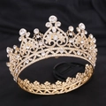 Macro detail of Baroque bridal crown featuring golden alloy heart scrolls and clear rhinestones - KC Gold White Rhinestone