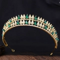 Close-up of golden Baroque bridal crown featuring green teardrop crystals and sparkling rhinestones - Gold Plated (Olive Green Rhinestone)