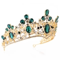 Detailed macro view of baroque gold crown with emerald green crystals and rhinestones - Gold Tone Olive Green Crystal Style