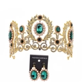 Detailed view of Baroque bridal crown and earrings set with green stones and pearls - Gold/Green