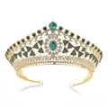 Macro detail of vintage gold bridal crown featuring emerald crystals and baroque metalwork - Gold Green Zirconia