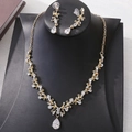 Detailed close-up of golden bridal jewelry set with sparkling floral cubic zirconia - KC Gold White Zircon Necklace + Earring Post