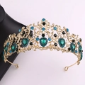 Close-up of vintage baroque crown with emerald green gems and blue rhinestones - KC Gold Green + Peacock Blue