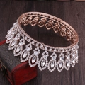 Close-up of Baroque rose gold bridal crown with crystal droplets on a vintage red box - Rose Gold with White Rhinestone