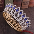 Detail shot of vintage golden baroque crown featuring marquise blue gems and rhinestones - Gold with Blue Rhinestones