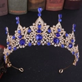 Detail of baroque gold crown featuring navy blue crystals and intricate white diamonds - Gold with Blue Rhinestones