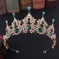 Detail showing baroque vintage gold crown with emerald green crystals and zircon accents - Gold with Green Rhinestones