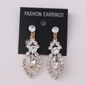 Detail of luxury gold rhinestone earrings with marquise cut drop and shiny crystal inlay - KC Gold White Rhinestone (Earring Post)