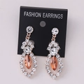 Elegant rose gold earrings with white rhinestones and champagne marquise center stone - Rose Gold Peach Rhinestone (Post)