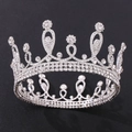 Detail shot of the glittering silver tiara with intricate floral rhinestone patterns - Silver Tone White Crystal Style