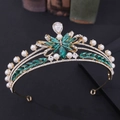 Detail view of gold bridal crown with emerald green stones and white pearls - Gold with Green Rhinestones