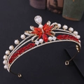 Detailed macro view of bridal tiara featuring red crystals and white pearls in gold - Gold with Red Rhinestones