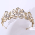 Macro shot of gold baroque crown with crystal rhinestones for bridal hairstyle - KC Gold White + AB Rhinestone