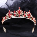 Detail shot of golden bridal crown featuring elegant red leaf-shaped rhinestones and side combs - KC Gold Red Rhinestone Hair Comb