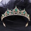 Detail of luxury bridal crown featuring emerald rhinestones and golden leaf patterns - Gold Tone Green Rhinestone